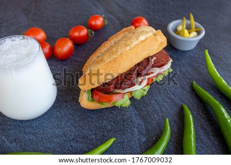 Grilled Sausage Between Bread - with tomato, pepper and onion