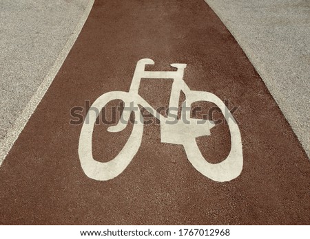 Marking a bike path on a park alley