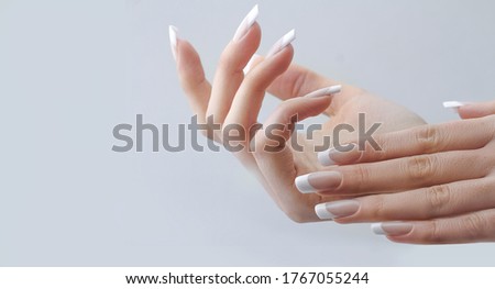 beautiful hands with manicured french nails manicure. nail extension Royalty-Free Stock Photo #1767055244