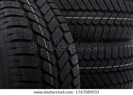 Close up picture of brand new black automobile tyre 