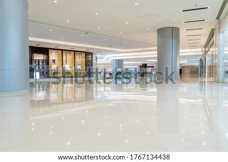 modern shopping mall corridor and storefront. Royalty-Free Stock Photo #1767134438