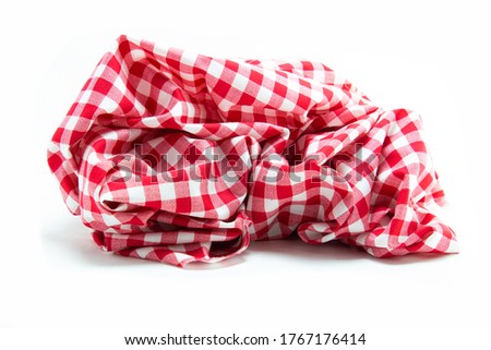Folded picnic blanket isolated on white background , Red gingham pattern