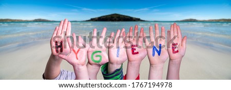 Kids Hands Holding Word Hygiene, Ocean Background