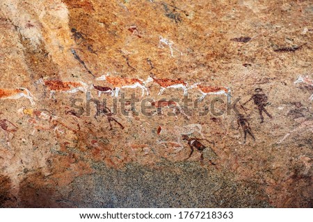 Bushmen rock paintings White Lady in Brandberg mountain area in Namibia. A spiritual site of great significance to the San (Bushman) tribes. Prehistoric archeological sign.