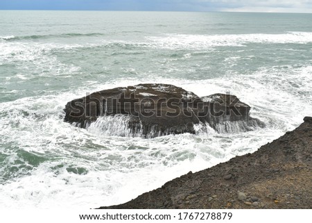 View of Piha beach coastal rock formation