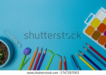 School supplies. Top view on a blue background with copy space. Back to school concept.