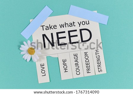 Tear-off stub note with text 'Take what you need' and words 'Love, Freedom, Hope, Courage' and 'Strength' with flowers on light teal blue background Royalty-Free Stock Photo #1767314090