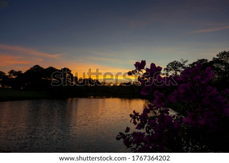 magical sunrise and sunset reflection on the lake with old architecture background and green pine forest