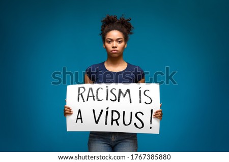 Racism is a Virus. Black girl holding banner for protest, rally or awareness campaign against racial discrimination of dark skin color.