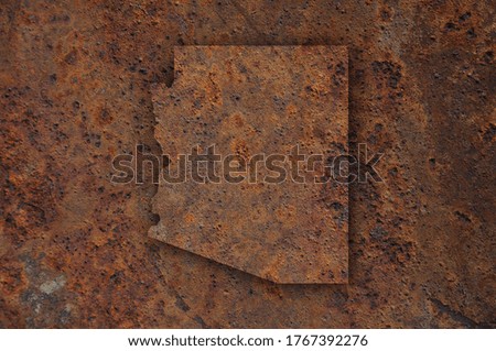 Detailed and colorful image of map of Arizona on rusty metal