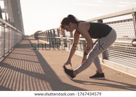 Young woman doing a stretching exercise