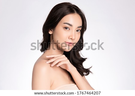Beautiful Young Asian Woman touching her body with fresh Healthy Skin, isolated on white background, Beauty Cosmetics and Facial treatment Concept