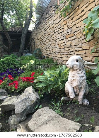 Garden stone sculpture Rabbit and flowers