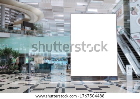 Blank advertising banner mockup in modern airport retail environment; large digital display screen. Billboard, poster, out-of-home OOH media display space. Royalty-Free Stock Photo #1767504488