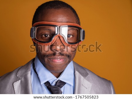 black man with pilot glasses