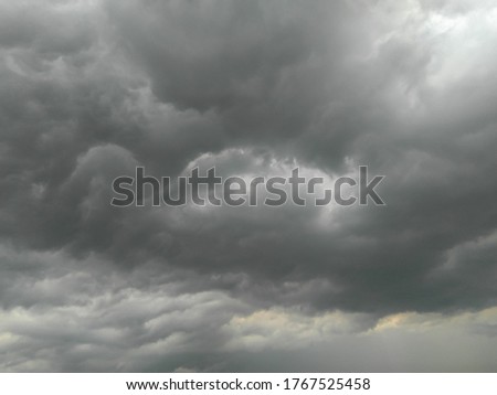 Dark gray cloudy sky background, nature photography, beautiful white clouds pattern, natural scenery view of rainy season weather conditions, atmospheric moods Royalty-Free Stock Photo #1767525458