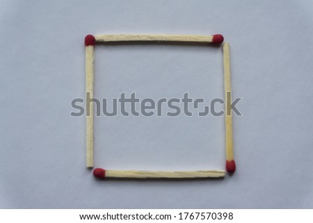 A square of matches on a white background. Top view. Mock up. Flat lay compositio