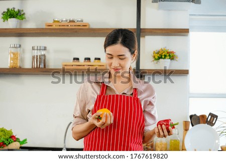 young attractive Asian woman recording cooking lesson online live streaming vlogger in the kitchen. Work from home concept. social media influencer concept.