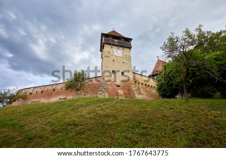 Fortified medieval saxon evangelic church in the village Alma Vii (Almen) Transylvania, Romania. The settlement was founded by the Saxon colonists in the middle of the 12th century Royalty-Free Stock Photo #1767643775