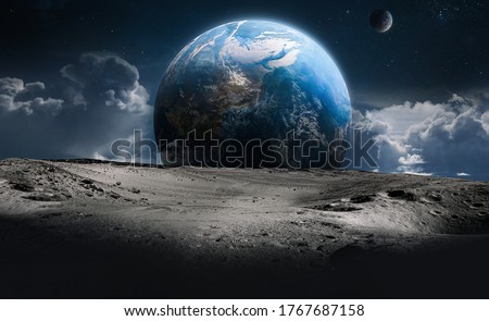 Moon surface with craters and Earth planet in deep space. Sky and clouds fantasy. Elements of this image furnished by NASA