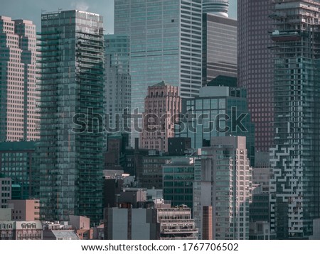 Asphalt jungle of DowntownToronto : a cluster of skyscrapers, flat  contrast aerial photo