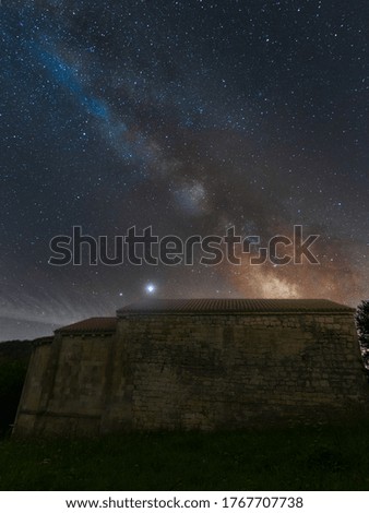 Milky way over an old Romanesque hermitage in the night