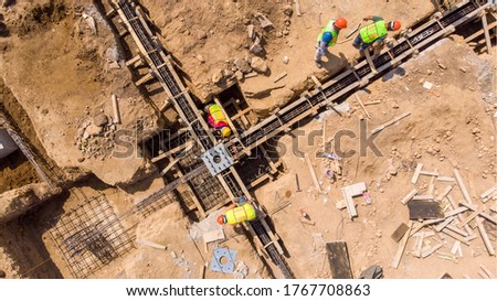 aerial view of men working in the construction industry