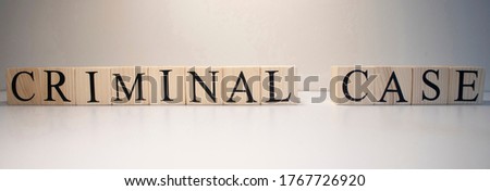 Criminal case word from wooden cubes. Crime and crime concept.