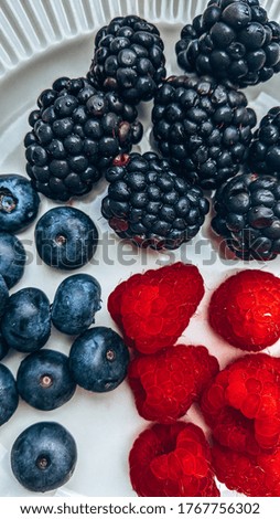 Raspberries, blueberries and blackberries for breakfast