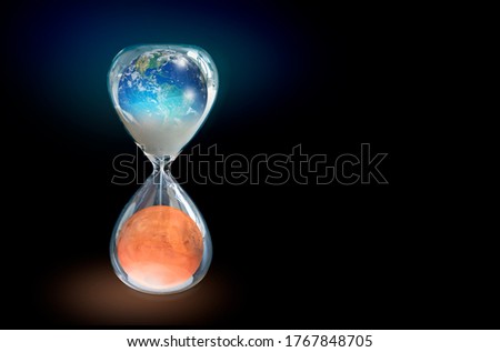 Global warming concept - Planet Earth is becoming a dead planet like Mars - Hourglass inside Planet Earth and Mars isolated on black background "Elements of this image furnished by NASA "