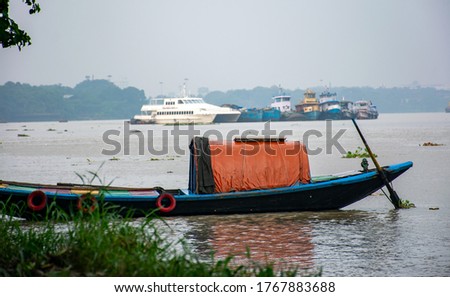 colourful photo of small boats or nouka in hooghly or ganges river from princep ghat or Millennium Park kolkata west Bengal