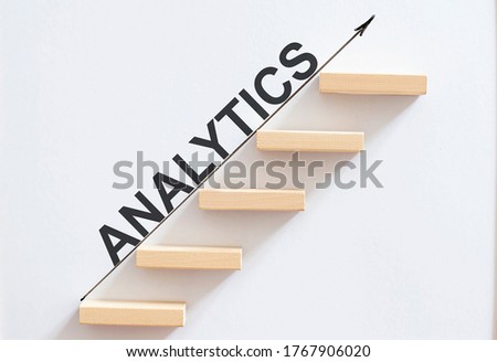 wooden stair made by wooden cube block with text ANALYTICS