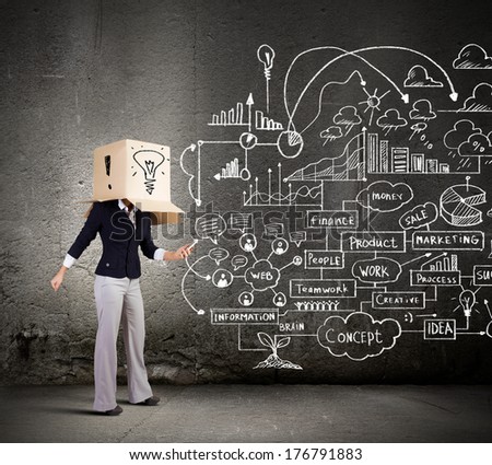Conceptual image of businesswoman with carton box on head