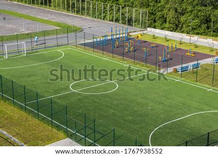 Open city sports grounds for playing football, stadium, weight training equipment, top view, General plan. Royalty-Free Stock Photo #1767938552