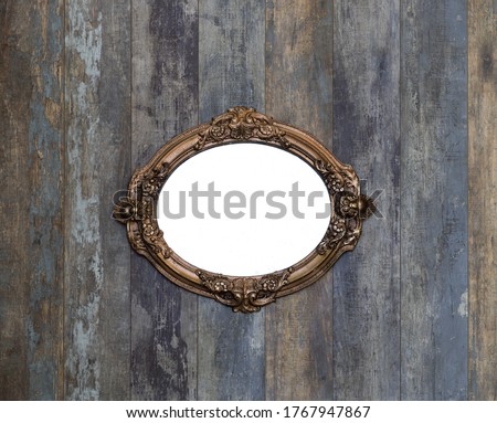 antique vintage golden mirror on old wooden wall
