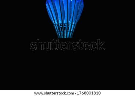 Hanging Blue Shuttle Cock in pitch dark