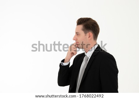 Businessman thinking with black suit isolated on white background