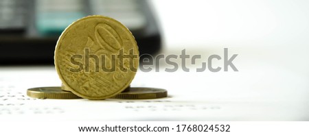  coin close up. in the background is a calculator. 50 cents. High quality photo