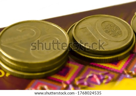  in the frame, coins lying on a bank card. financial independence. High quality photo