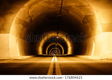 long mystical underground tunnel with lights
