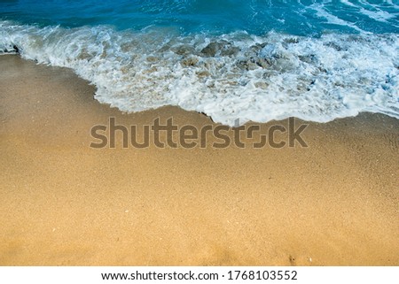 Wave foam on  seashore. Seascape, seaside sand with copy-space. Tropical ocean tranquil shoreline surface with wavy splash. paradise scenic peaceful photography. idyllic seacoast plaza with beach sand