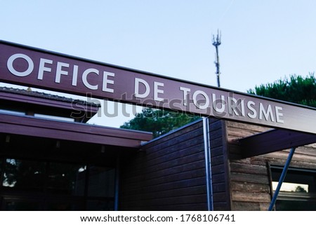 office de tourisme sign text in French means tourism office on wall agency in France
