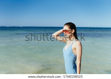Woman blue swimsuit sunglasses lifestyle tropics ocean island sun travel