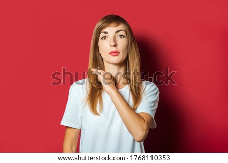 Young beautiful woman on a pink background
