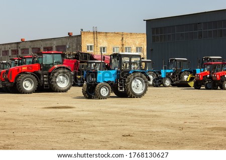 Tractors and cab harvesters. Agricultural machinery at the assembly plant.Selective focus