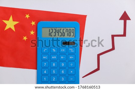 China flag with red growth arrow and calculator. Arrow graph going up. The economic growth