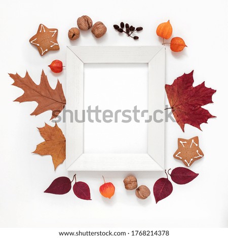 autumn layout, wooden white frame, fallen autumn bright leaves, berries, fruits on a white background, blank, base, mock up for design, cozy autumn mood