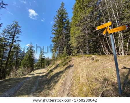 Mountaineering signposts and markings on the hills over the Eigental alpine valley and in central Switzerland, Eigenthal - Canton of Lucerne, Switzerland