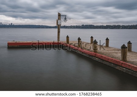 A long exposure technique to smooth out the water while keeping the dock sharp and crisp. A storm is brewing in the sky.