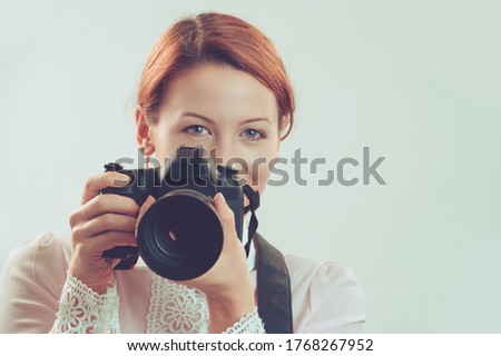 Photographer. Closeup portrait head shot young woman lady girl taking pictures with retro, vintage style dslr camera isolated green background wall. Wedding travel photography hobby, paparazzi concept